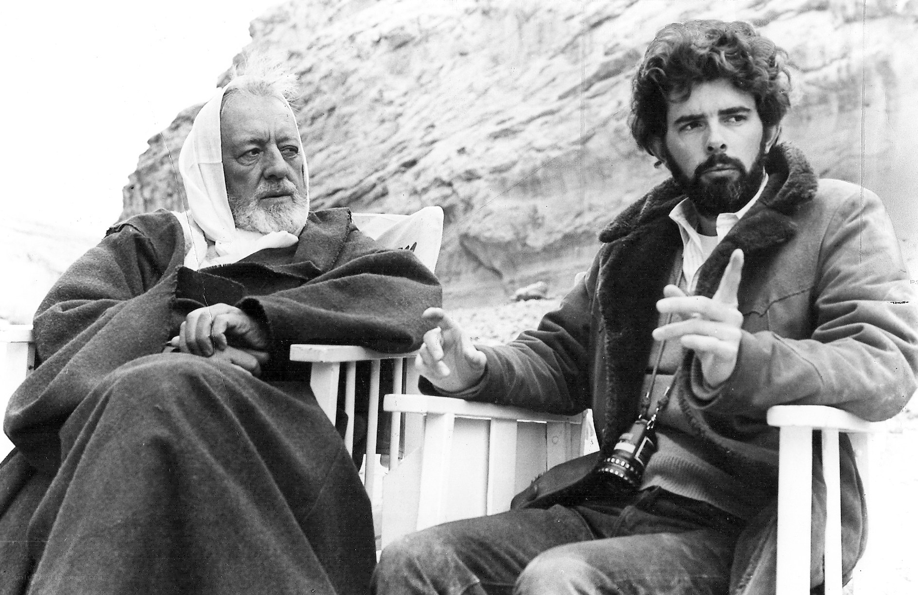 Two men sitting outdoors