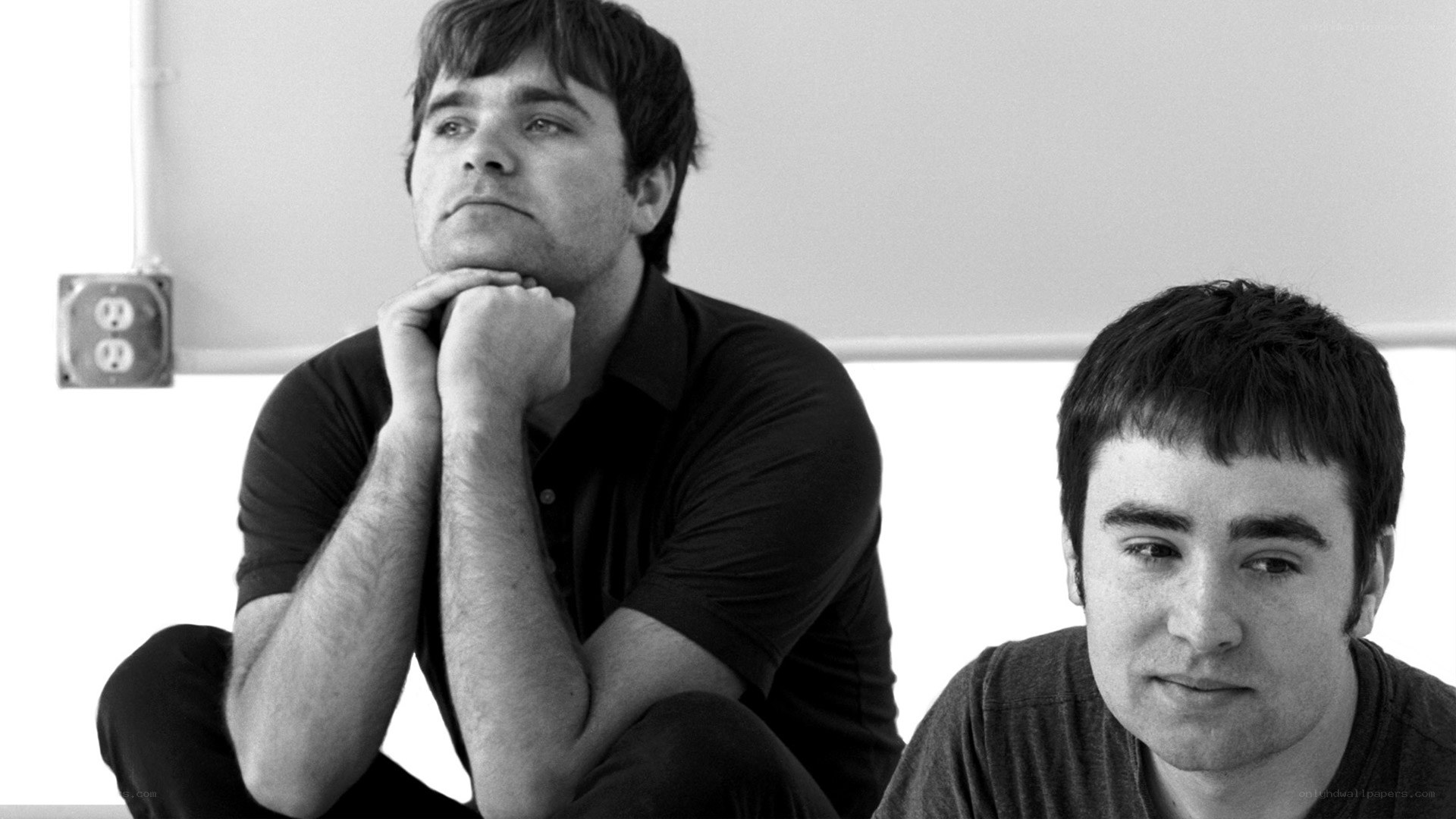 two men sitting together