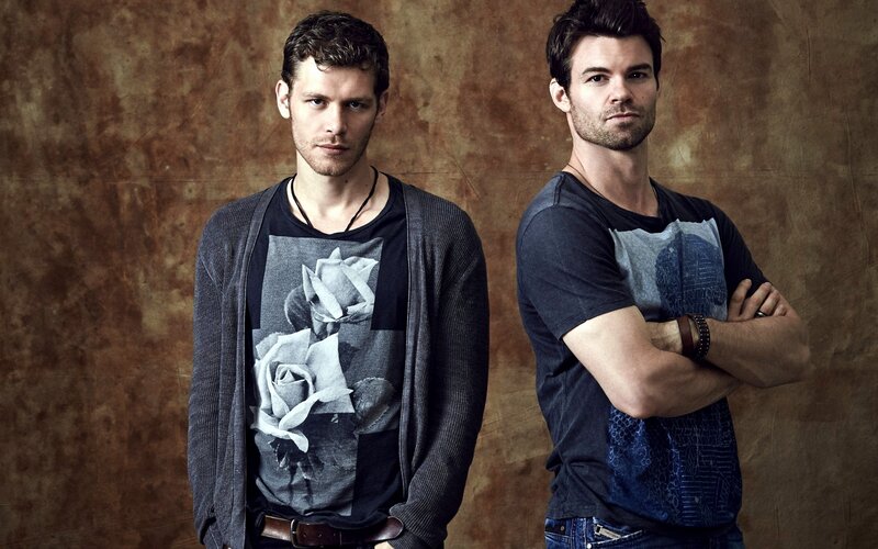 Two Men Standing — Brown, Serious, Photograph, T-shirt