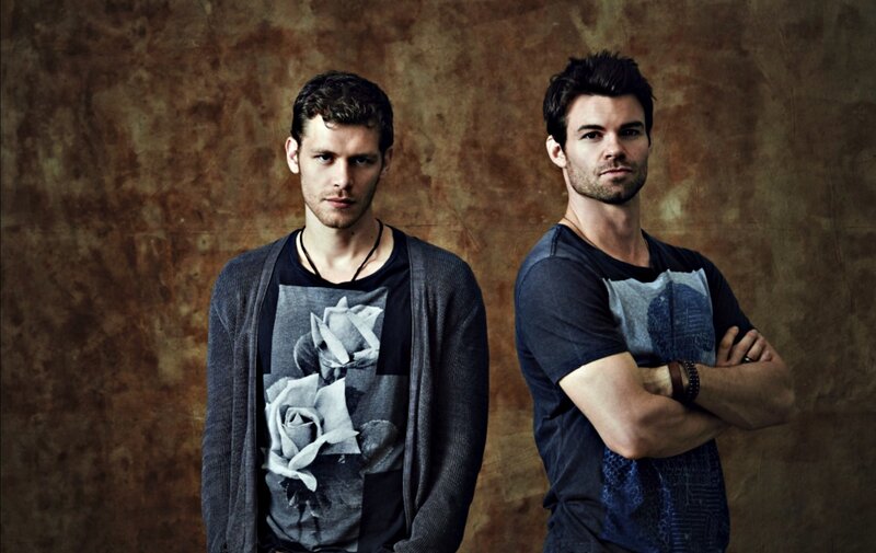 Two Men Standing — Brown, Serious