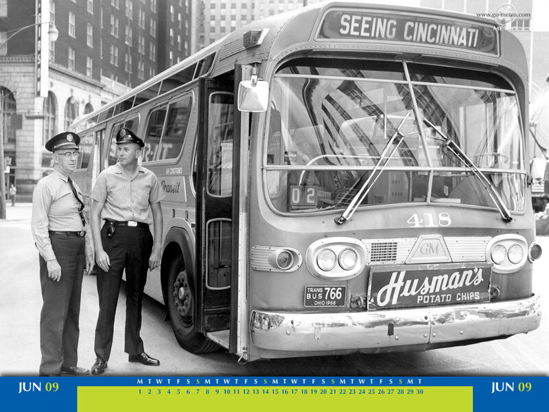 Two Men Standing by a Bus