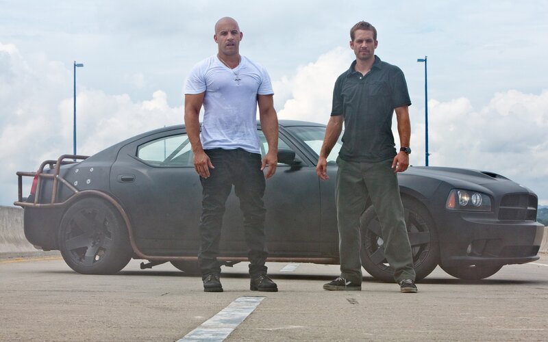 Two Men Standing — Gray, Dramatic, Afternoon, Photograph, Car