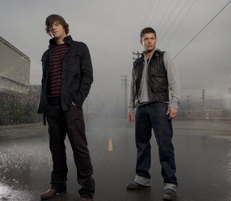 two men standing in the rain