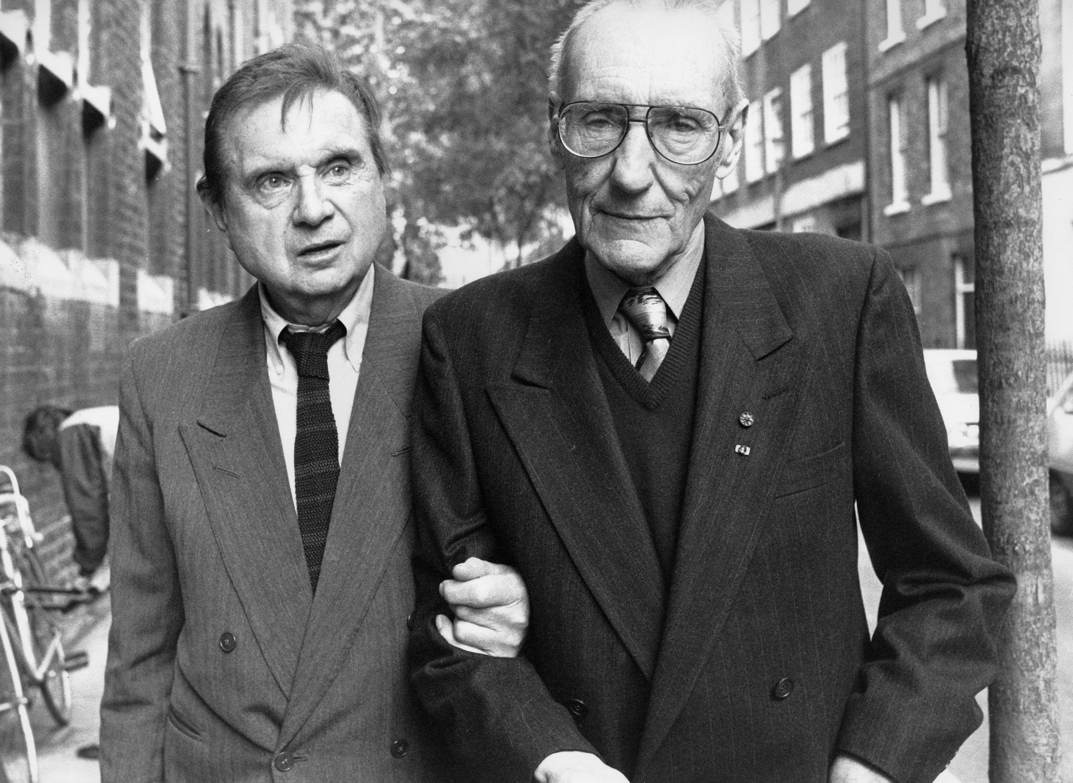 Two men standing on a street