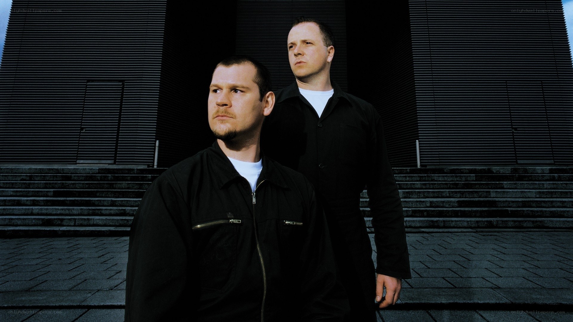 two men standing outside