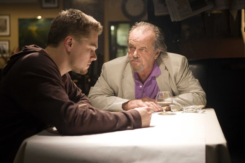 Two men talking at a table