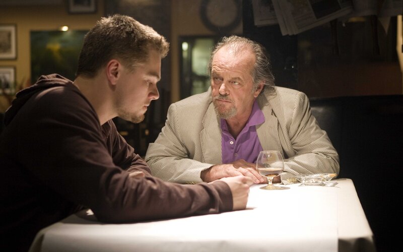 two men talking at a table