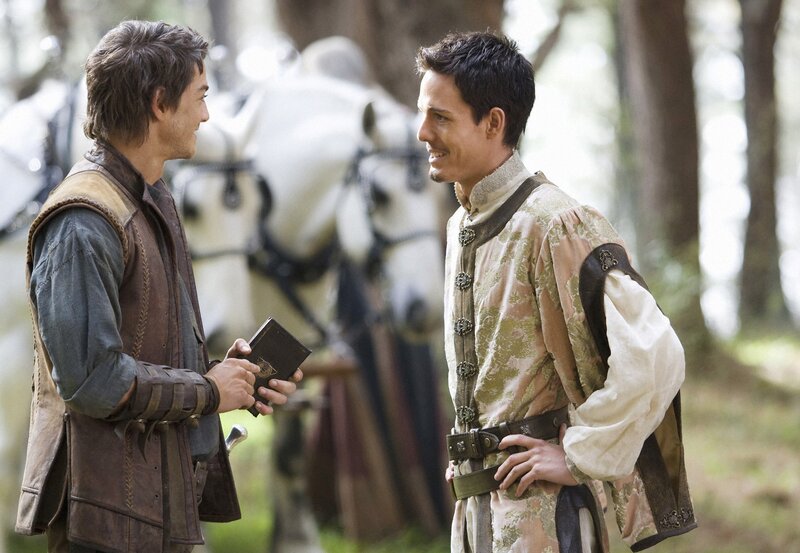 Two men talking in a forest
