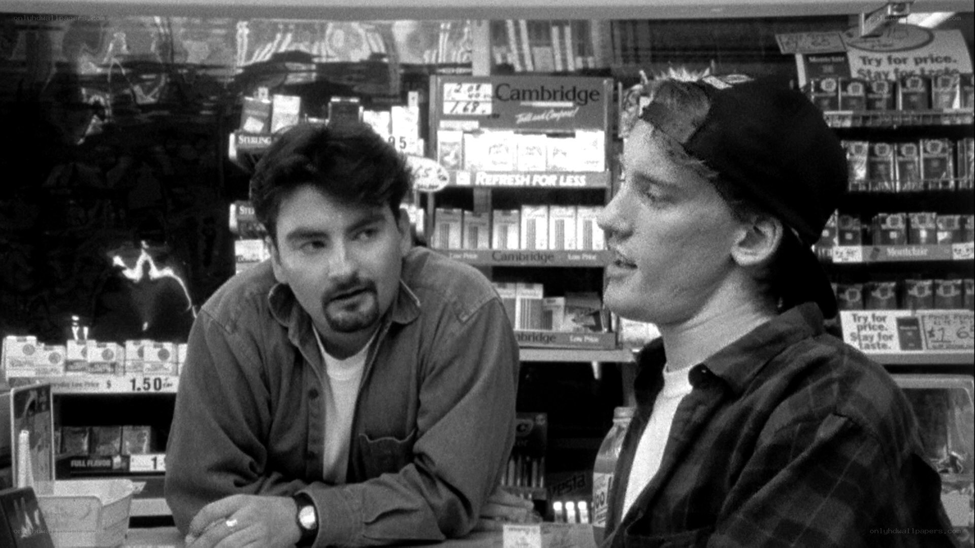 two men talking in a store