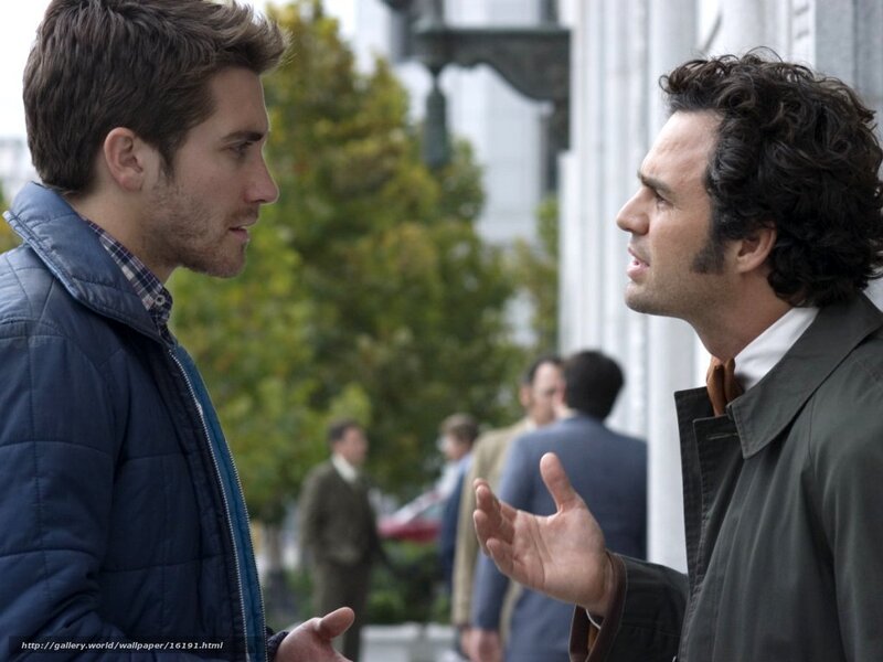 two men talking on street
