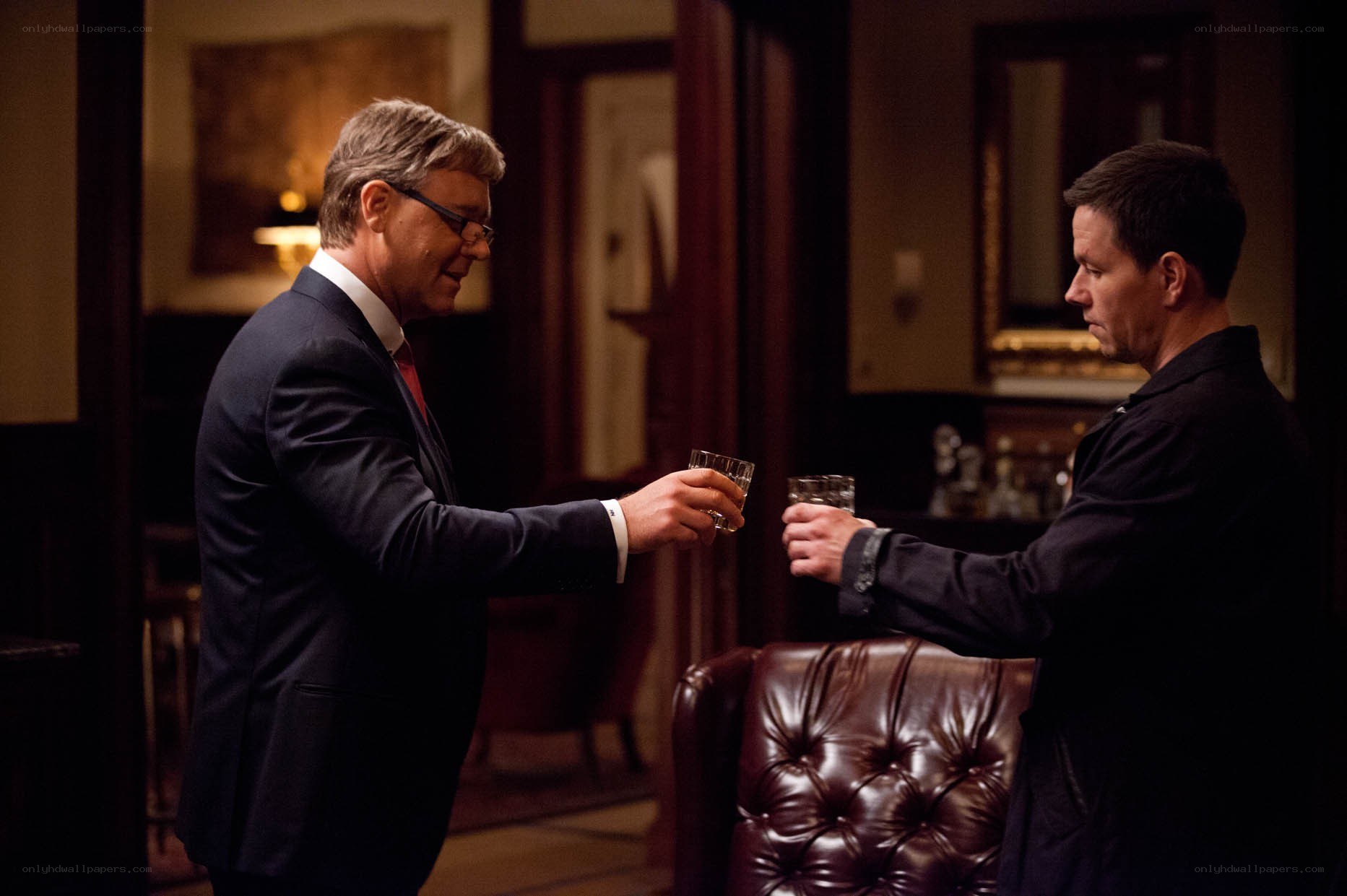 two men toasting with drinks