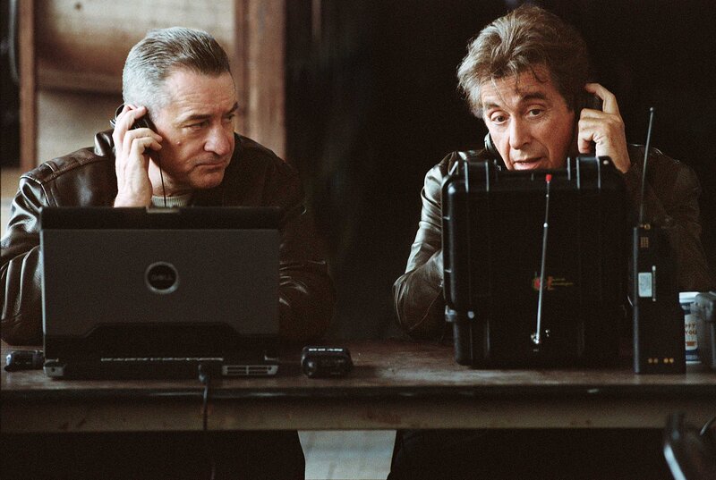 Two Men Using Radios