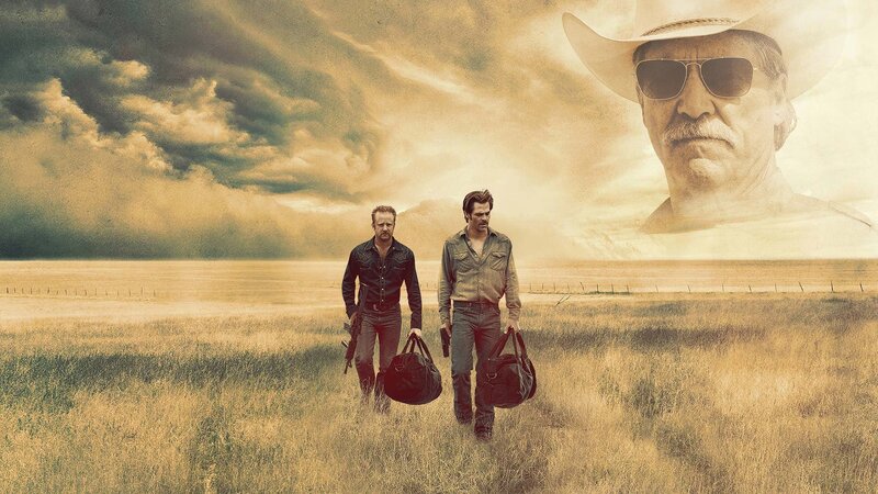 Two men walking in a field