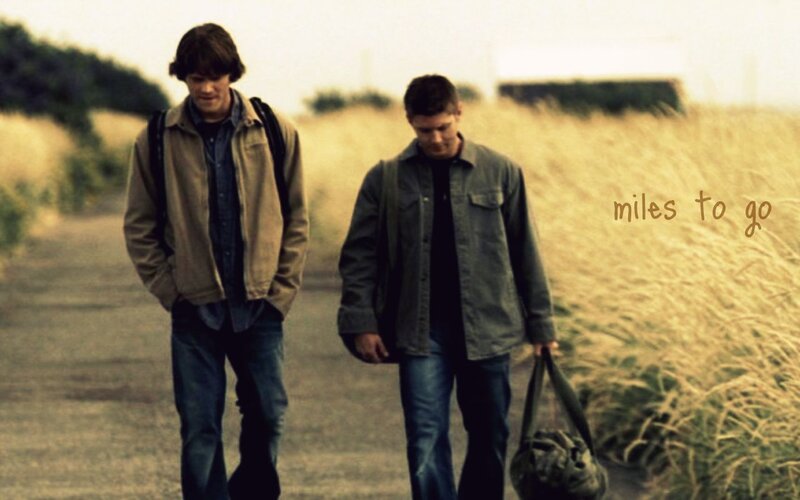 two men walking on a path