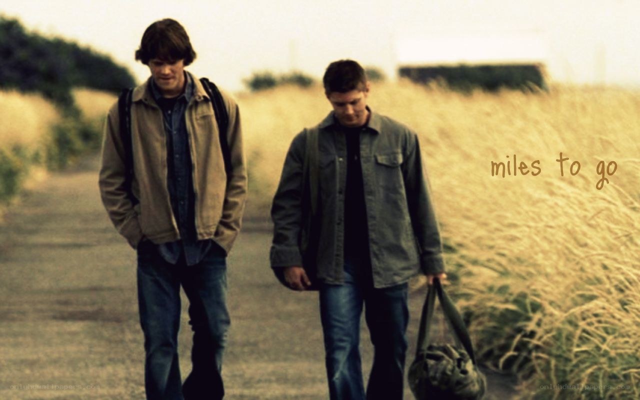 two men walking on a path
