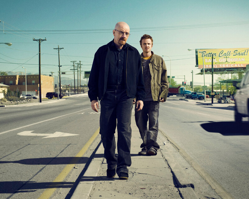Two Men Walking on Sidewalk