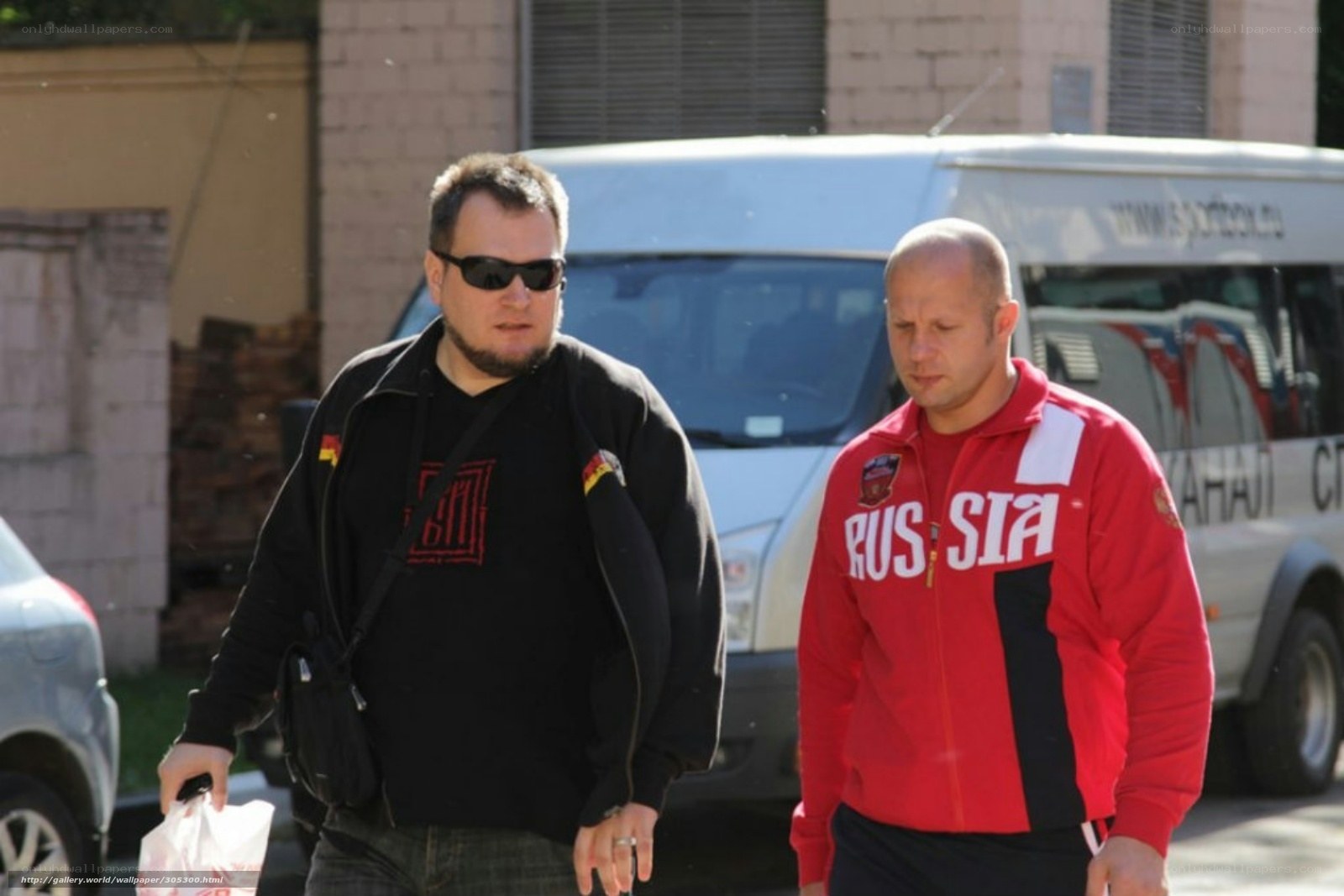 Two men walking on street