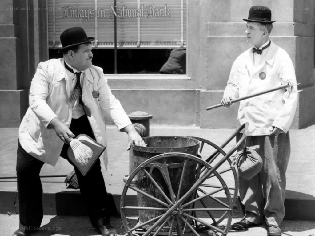Two men with a cart on a street