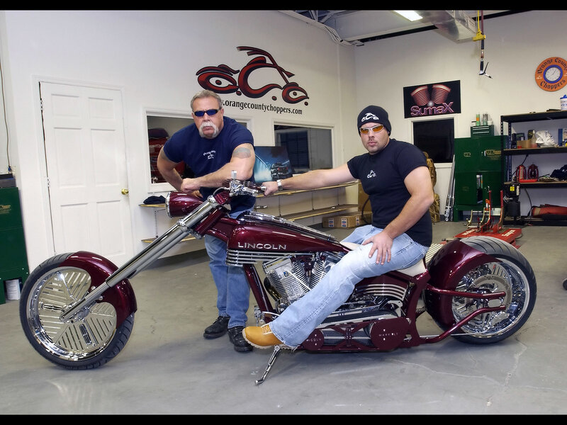 Two men with a custom chopper