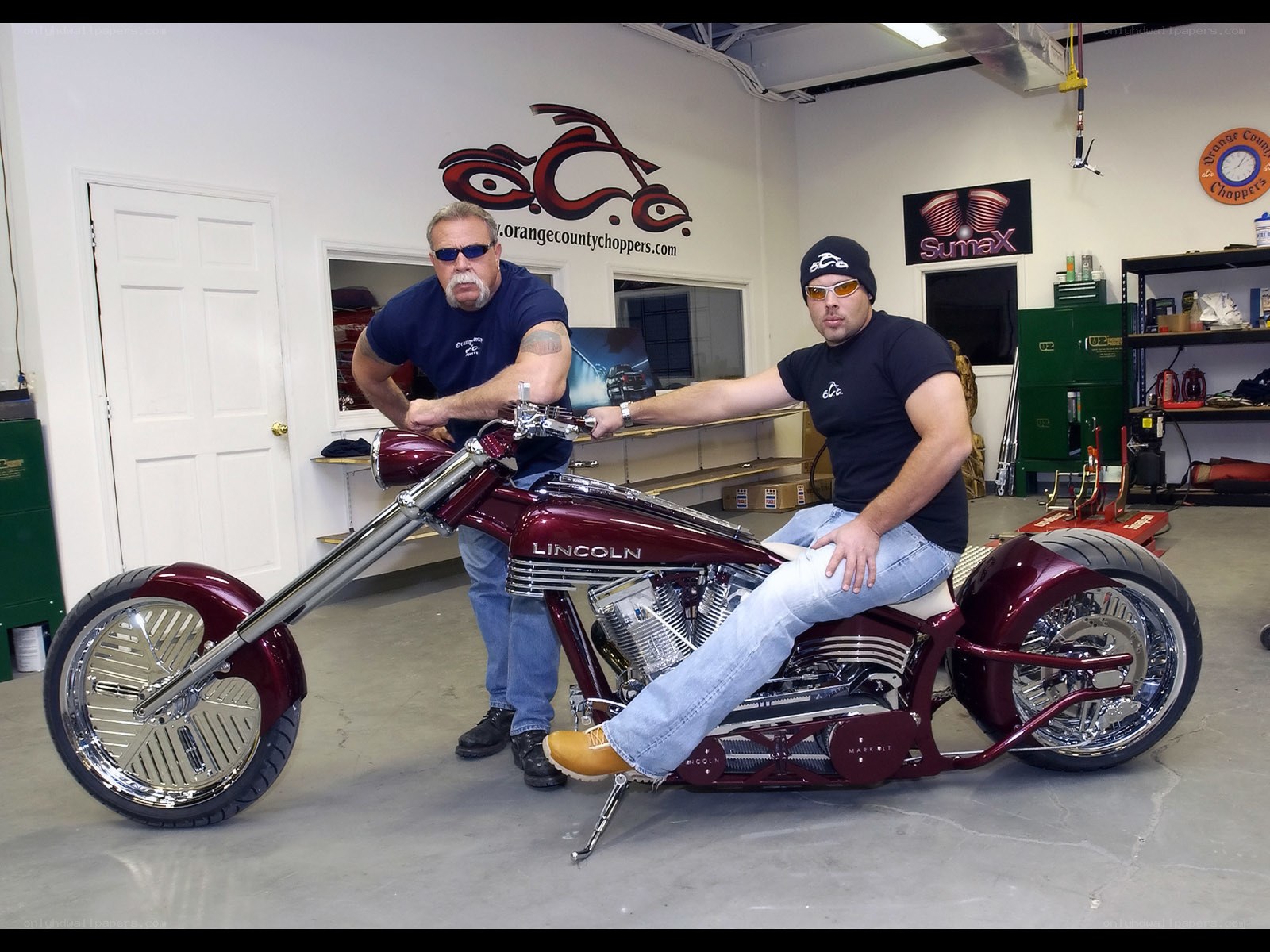 Two men with a custom chopper