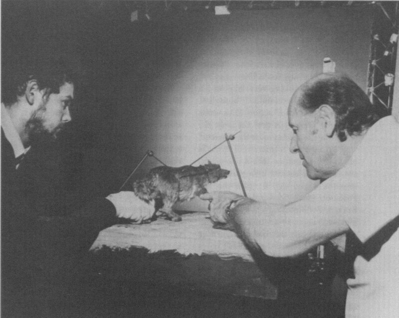 Two men with a model dog