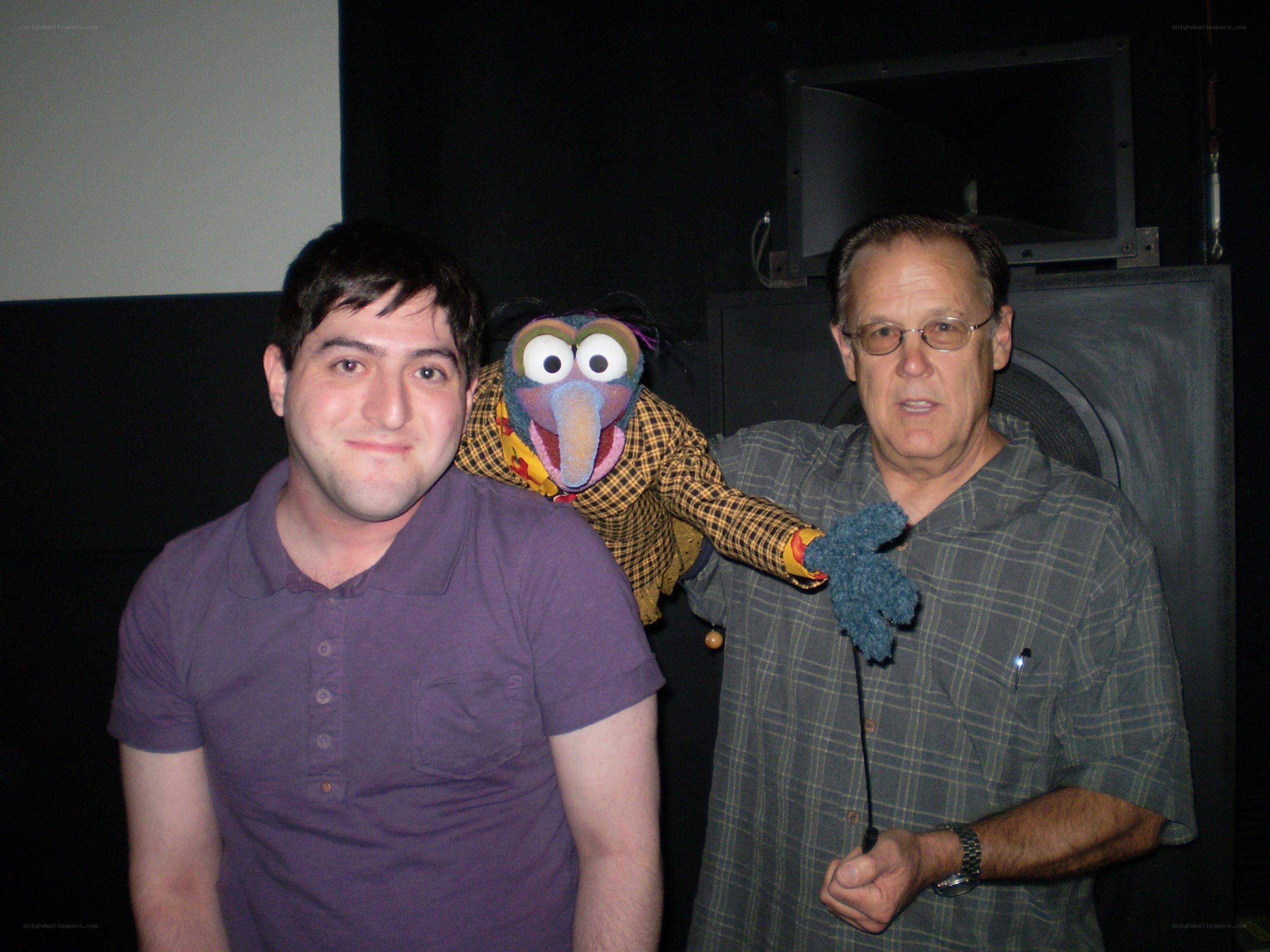 Two men with a puppet