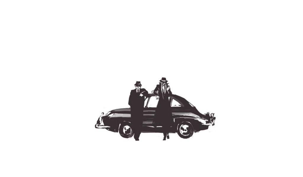 two men with a vintage car
