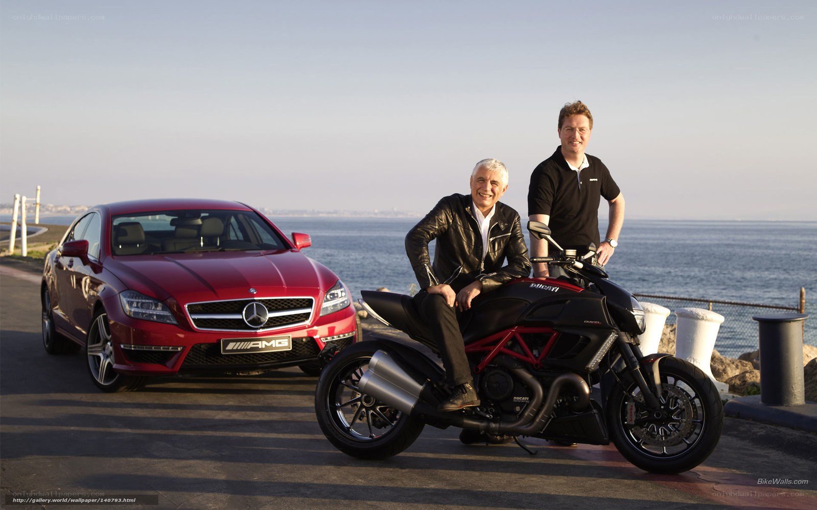 Two men with car and motorcycle
