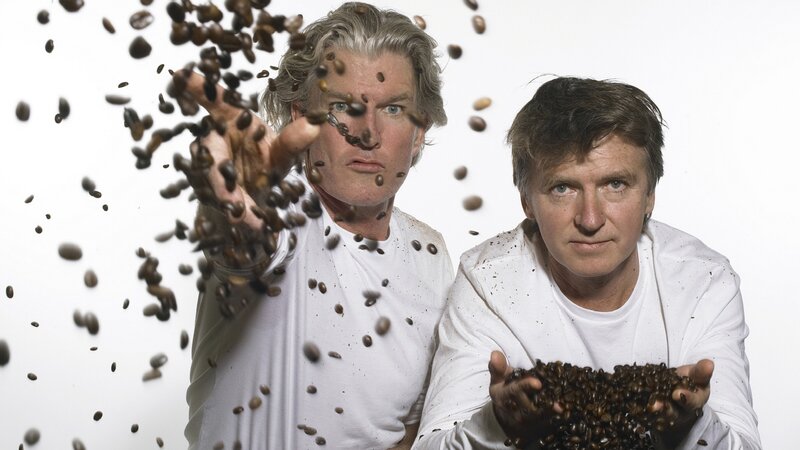 Two men with coffee beans