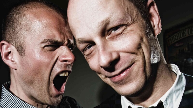 two men with contrasting expressions