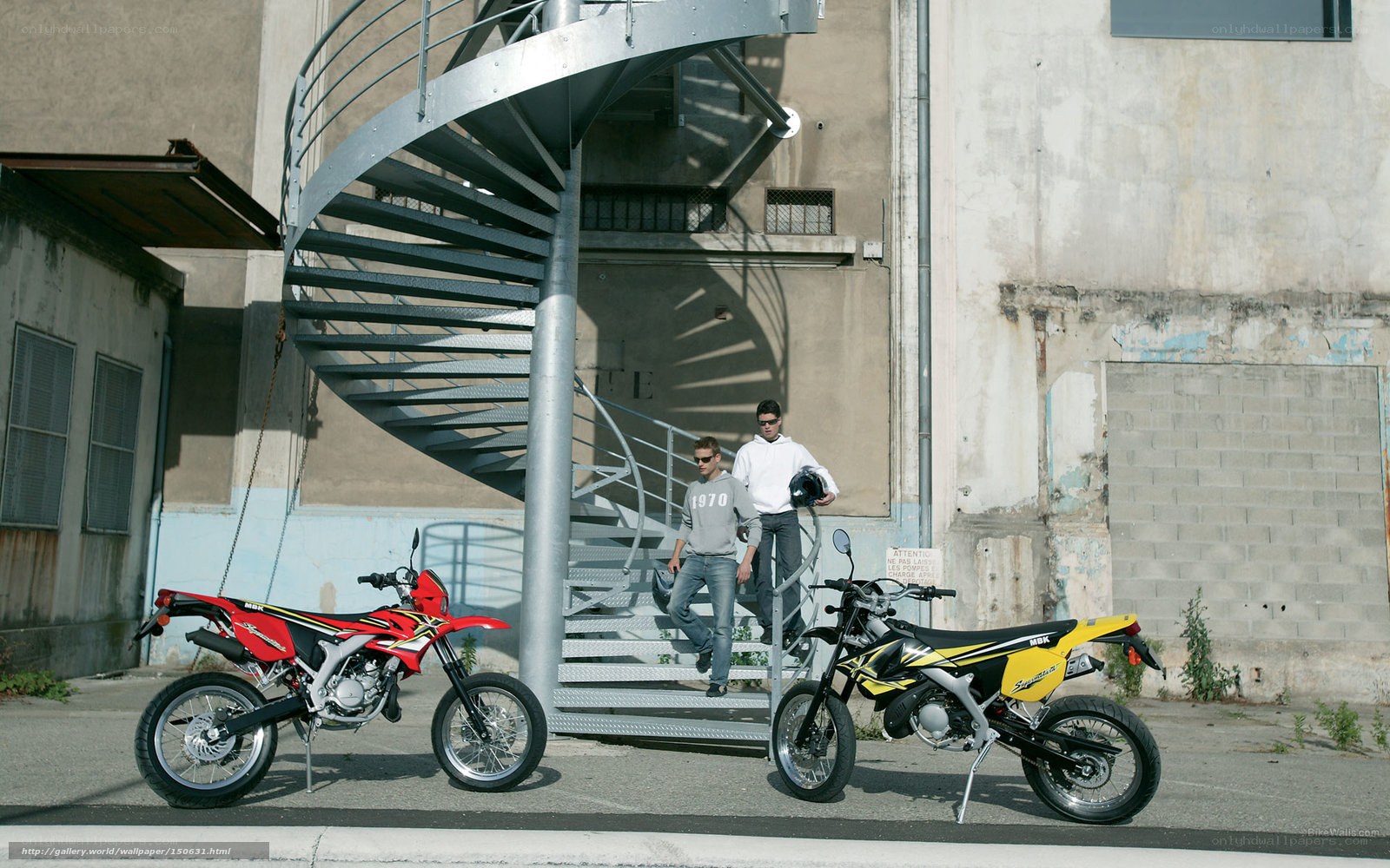 Two men with dirt bikes
