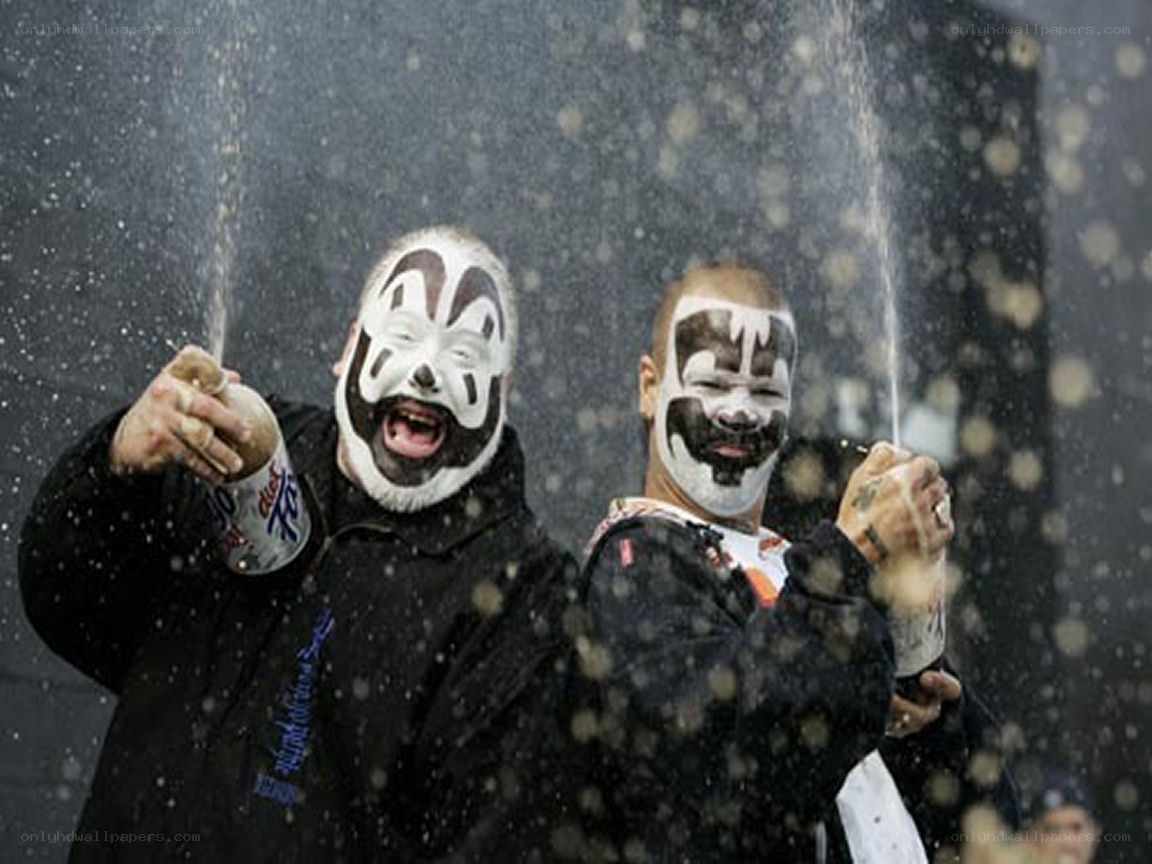 Two men with face paint celebrating