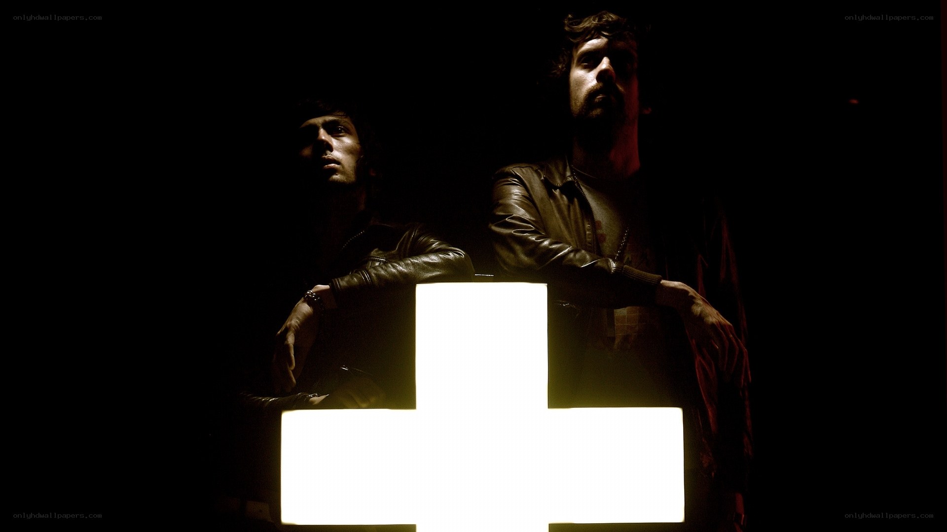 two men with glowing cross
