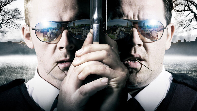 Two men with guns and sunglasses