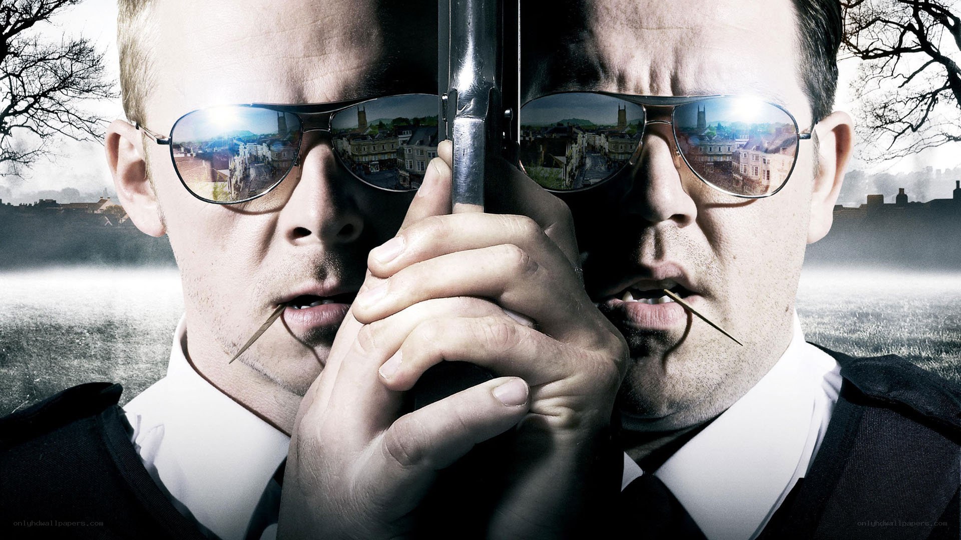 Two men with guns and sunglasses