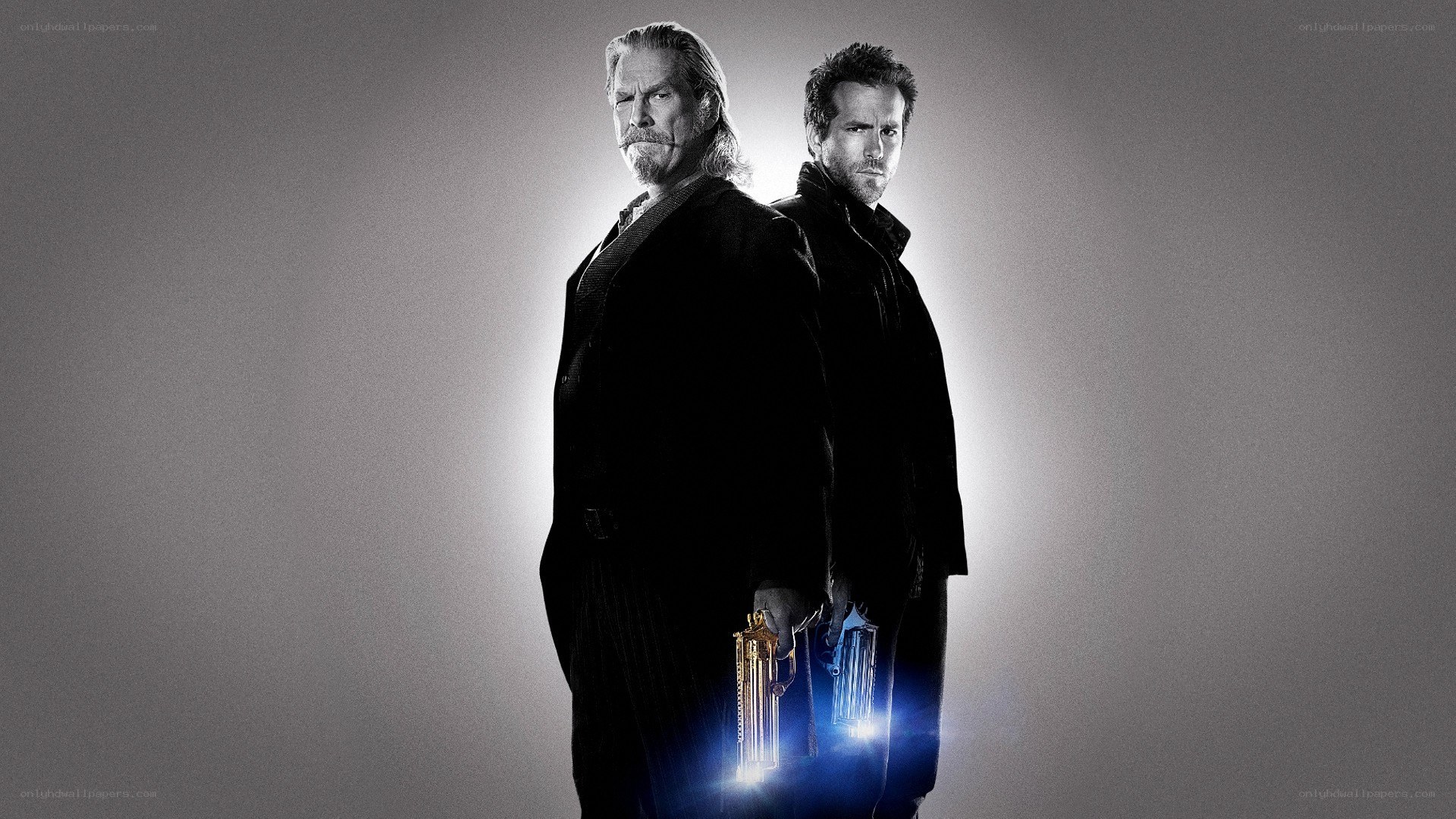 Two men with guns in dark coats