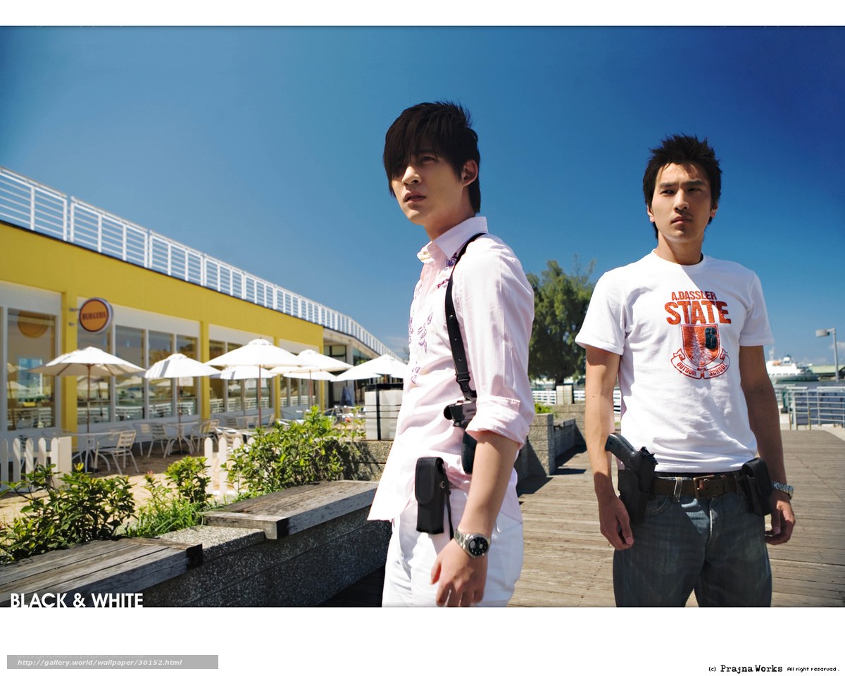 Two men with guns on a pier