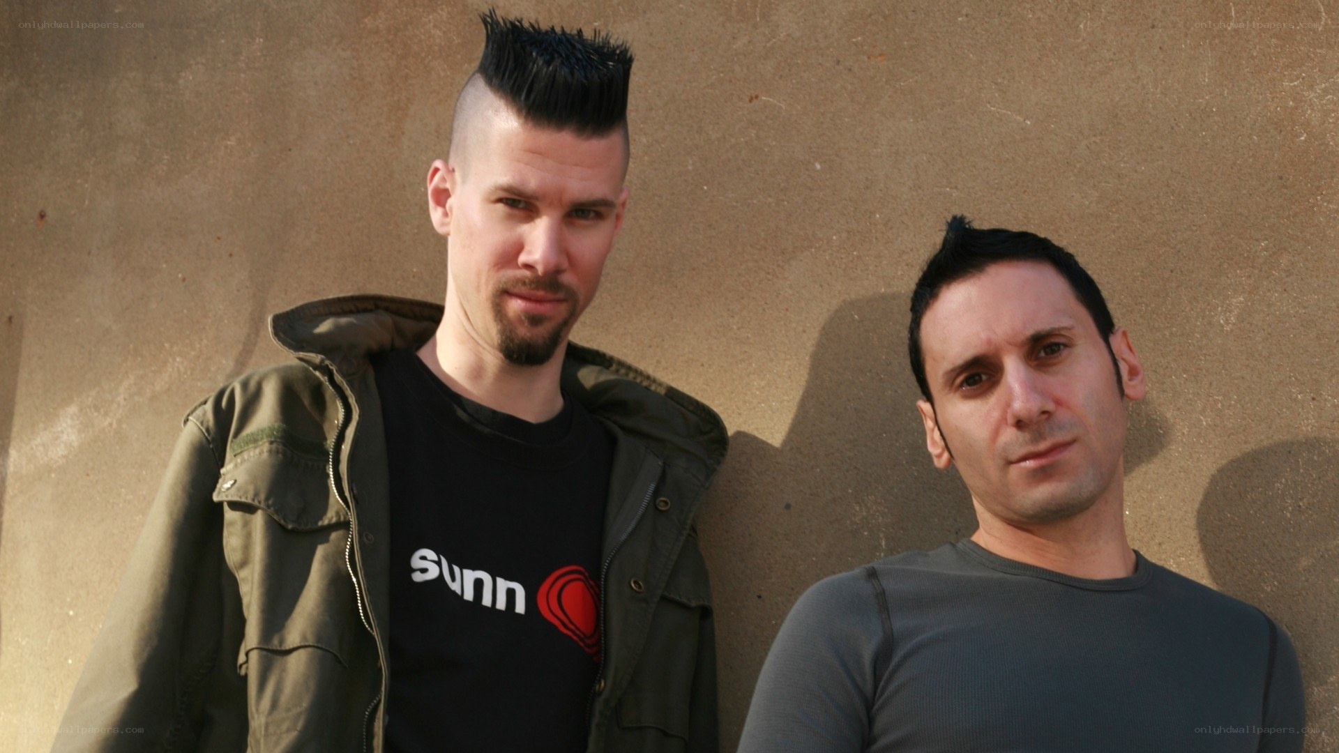 two men with mohawk hairstyles
