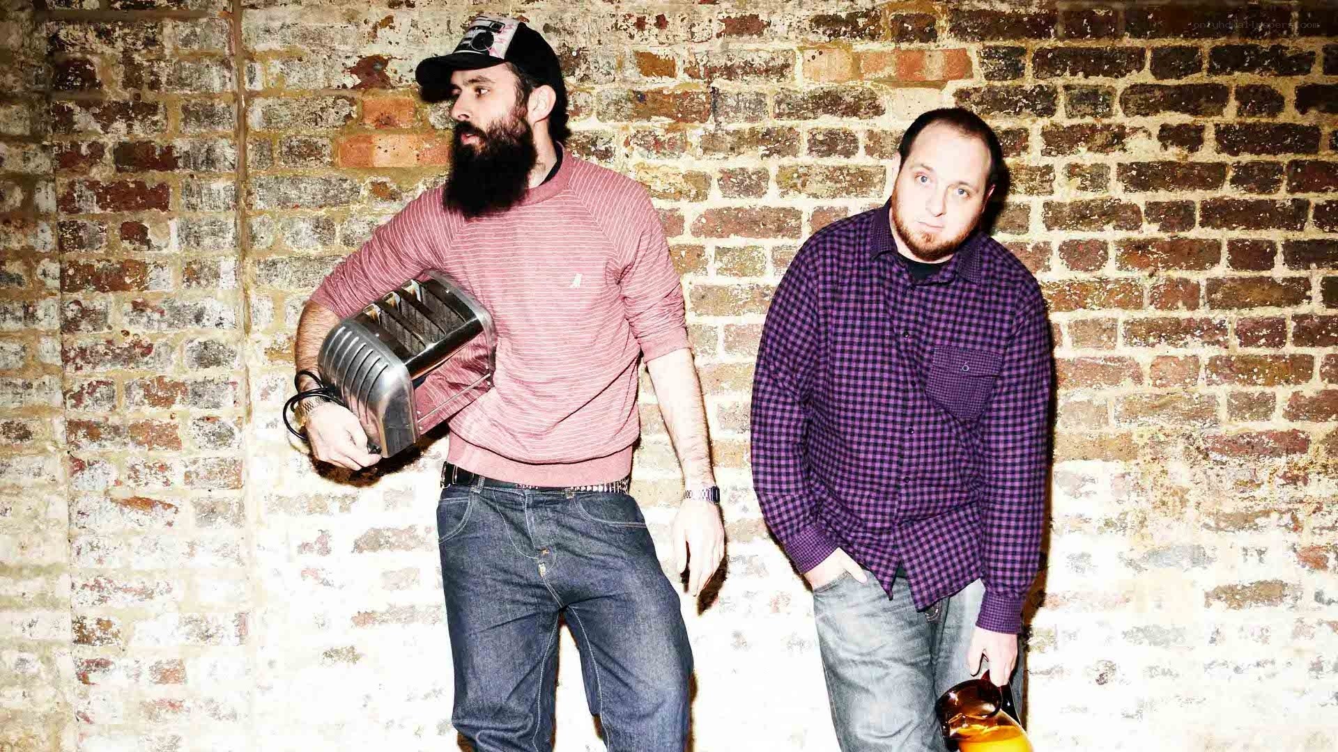 Two men with toaster and bottle