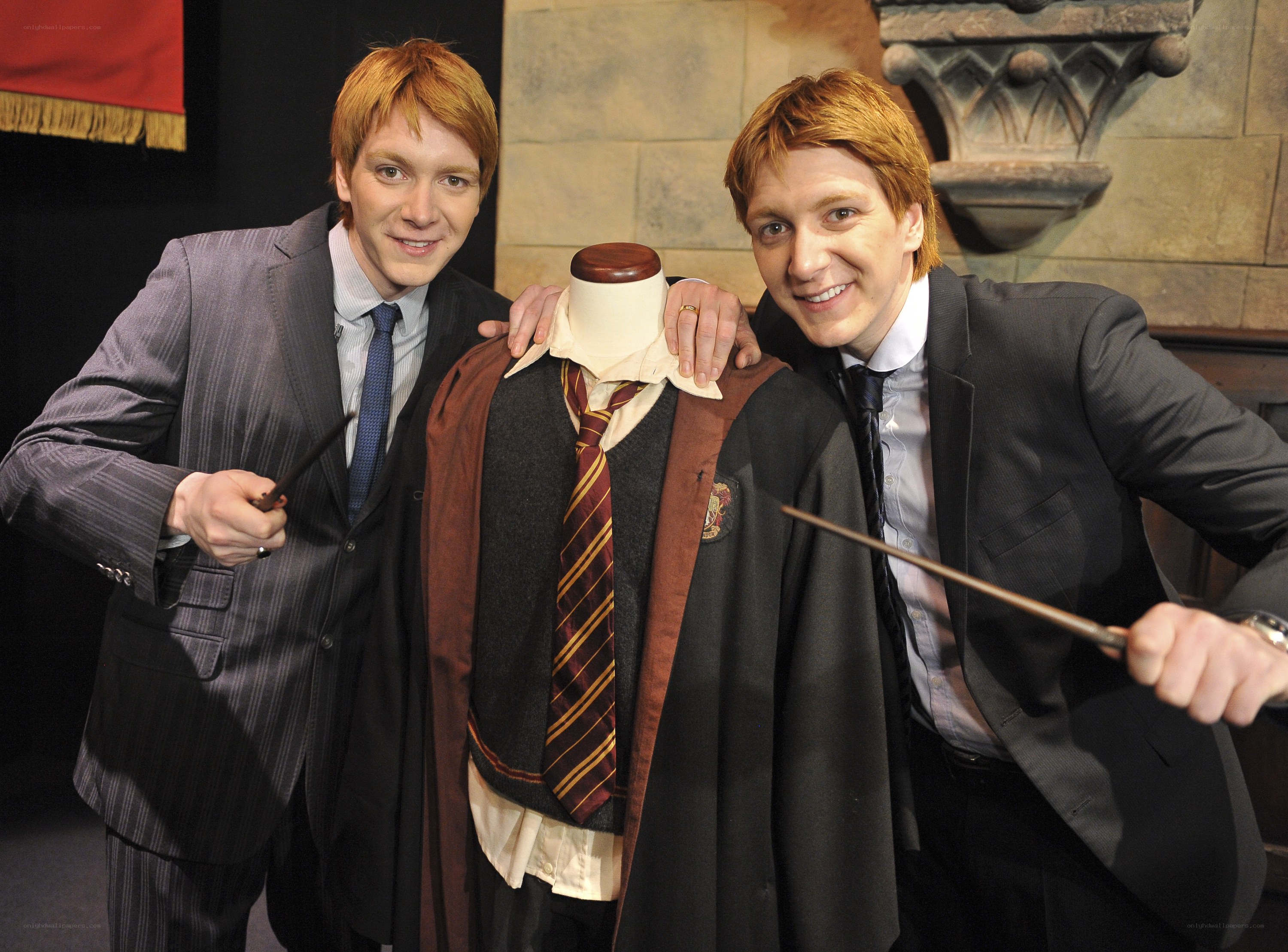 Two men with wands and costume