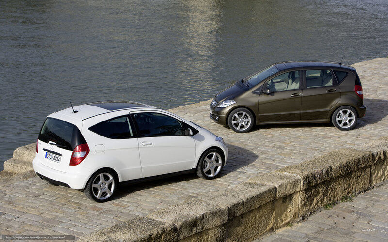 Two Mercedes-Benz A-Class cars by water
