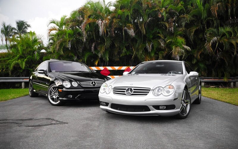 Two Mercedes-Benz cars parked