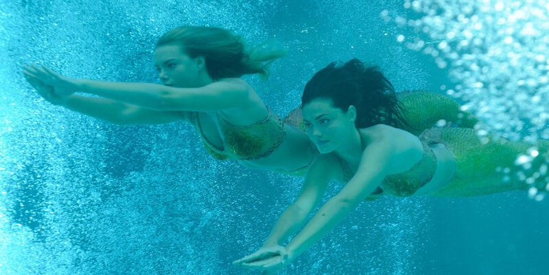 Two Mermaids Swimming