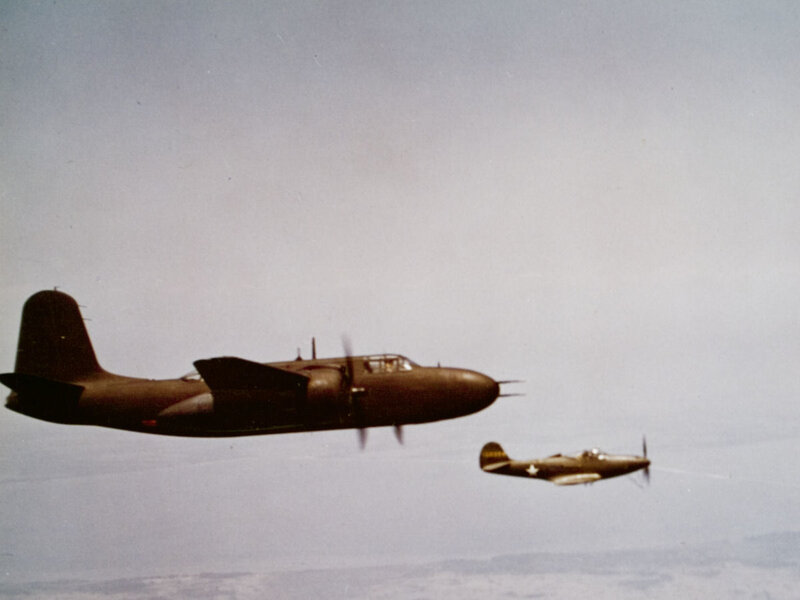 Two Military Aircraft in Flight — Gray