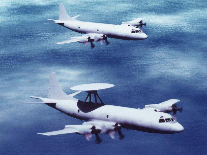 Two military aircraft over ocean
