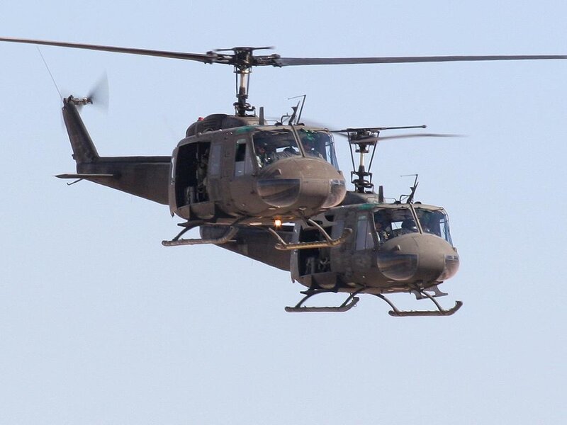 Two Military Helicopters — Green