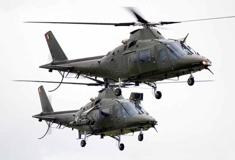 Two military helicopters in flight
