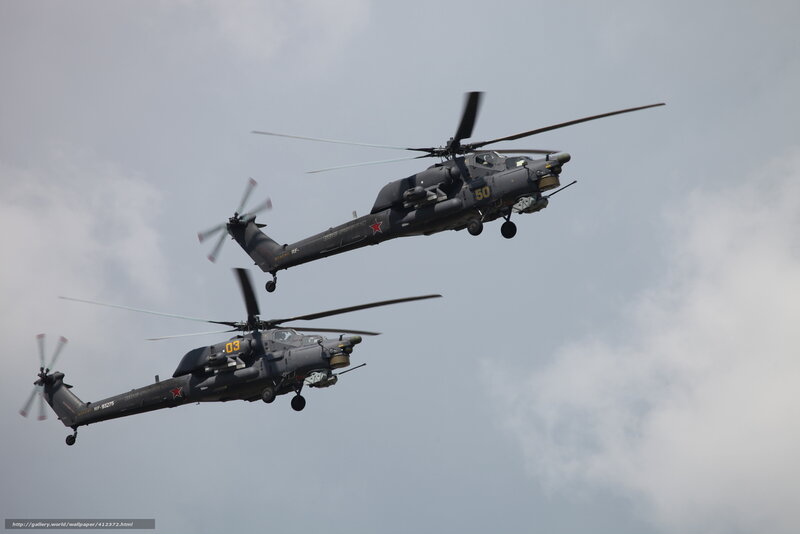 Two military helicopters in flight