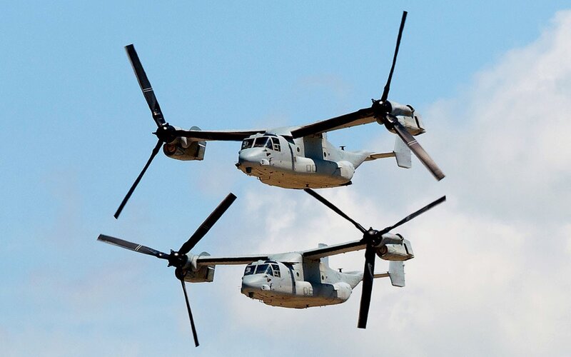 Two military helicopters in flight