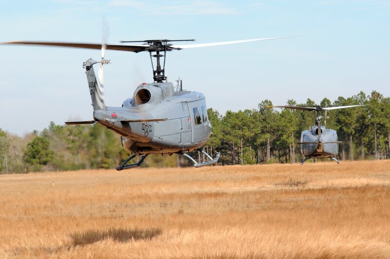 Two military helicopters in flight